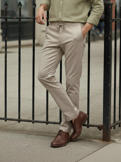 *Celio Men Beige Solid Baggy Fit Polyester Trousers