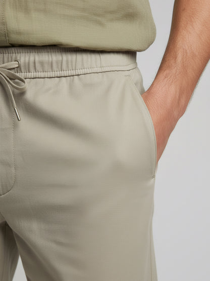 *Celio Men Beige Solid Baggy Fit Polyester Trousers