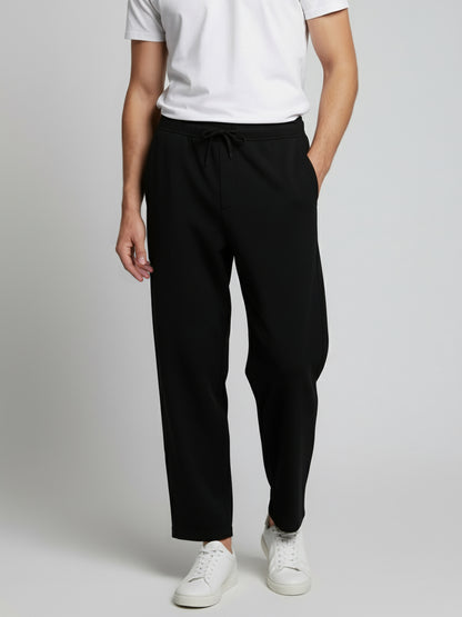 *Celio Men Black Solid Baggy Fit Polyester Trousers