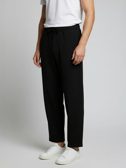 *Celio Men Black Solid Baggy Fit Polyester Trousers