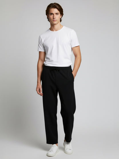 *Celio Men Black Solid Baggy Fit Polyester Trousers