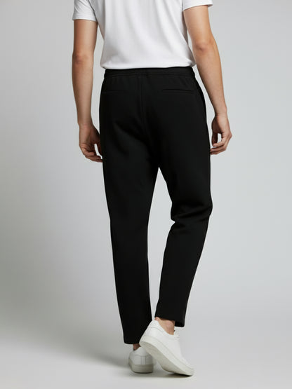 *Celio Men Black Solid Baggy Fit Polyester Trousers