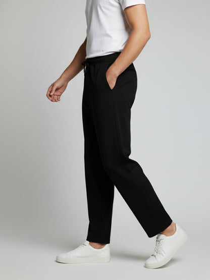 *Celio Men Black Solid Baggy Fit Polyester Trousers