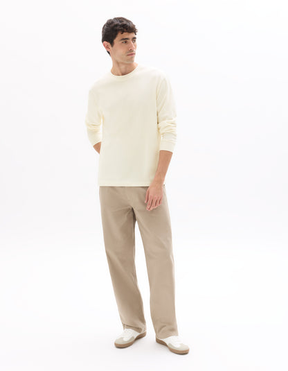 Celio Men Beige Solid Loose Fit Cotton Trousers