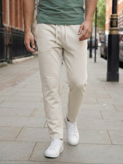 Celio* Men Beige Solid Straight Fit Cotton Trousers