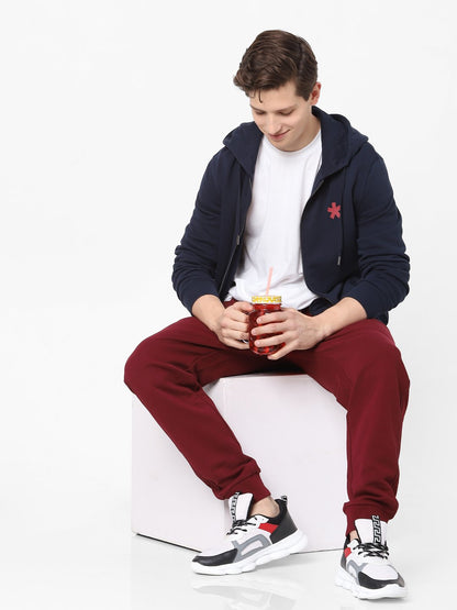 Celio* Men Burgundy Solid Jogger Fit Cotton Trousers